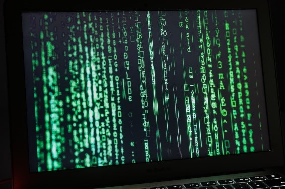 Cybersecurity codes running on a laptop screen