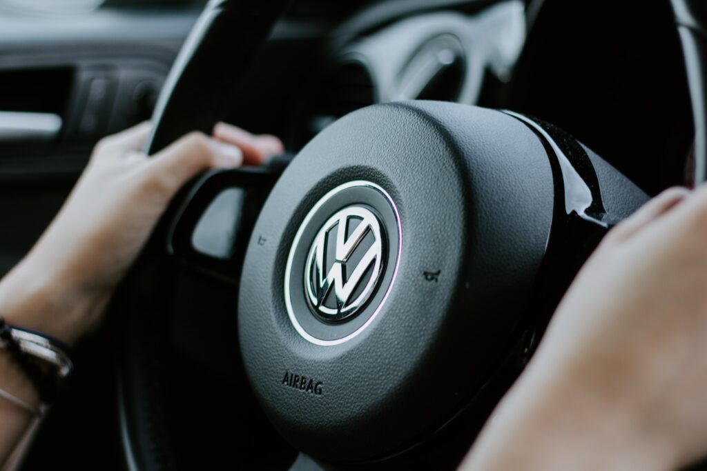 hands on a volkswagen steering wheel
