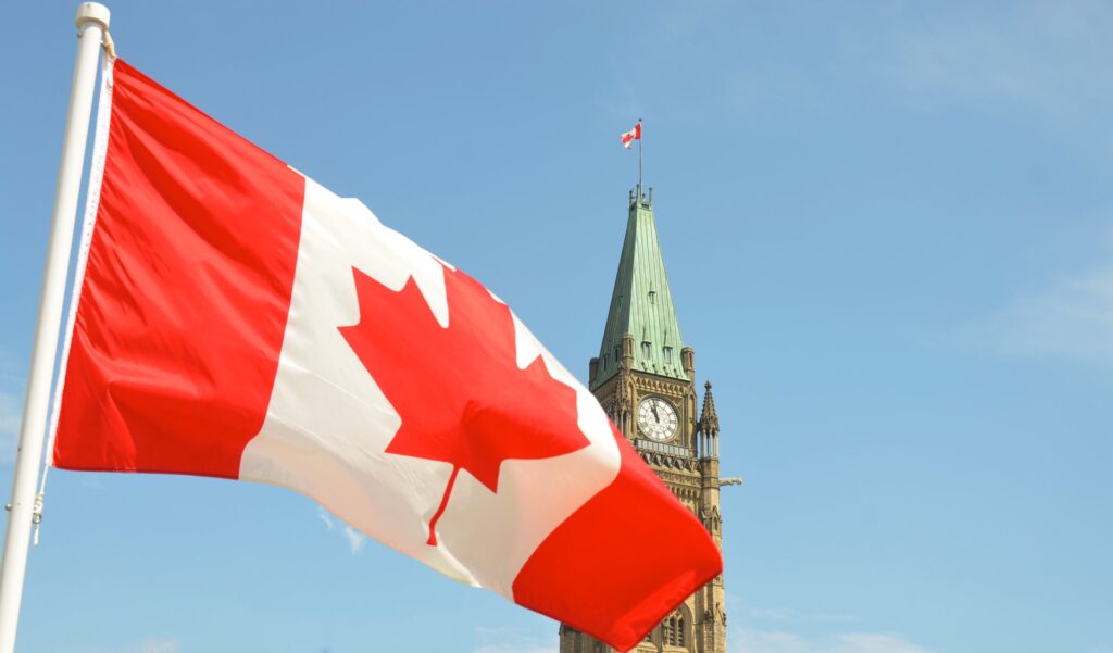 Canadian flag over the Ottawa parliament