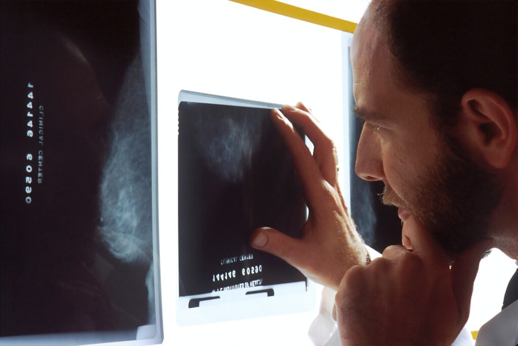 male looking at an xray image