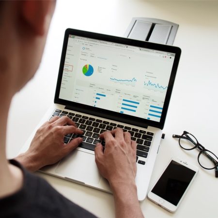 Person using laptop to view a report